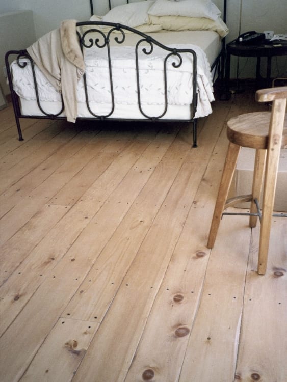 hand scraped edge flooring in bedroom