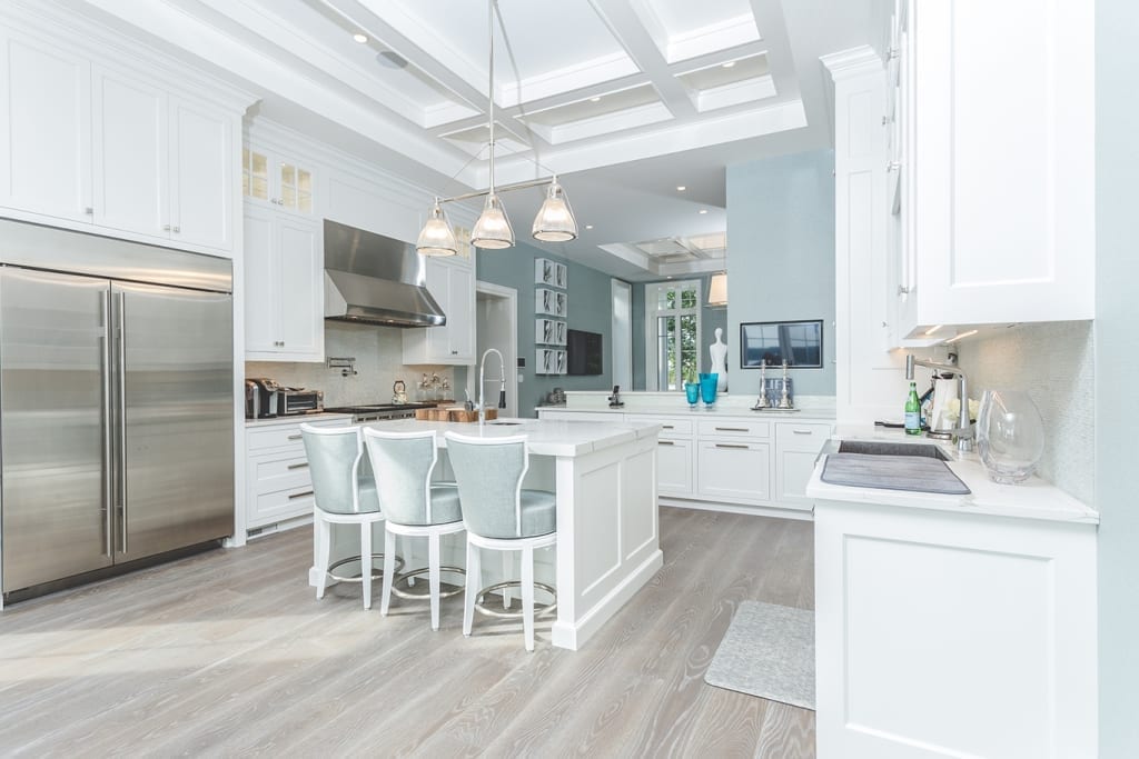 Carlisle Wide Plank Floors Optimistic Stone Floors in White Kitchen