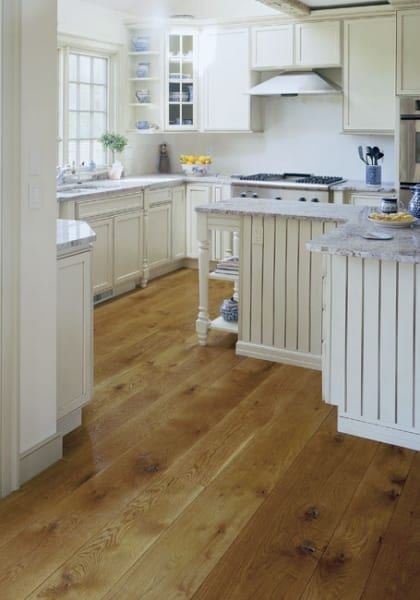 White Kitchen with brown wood floors