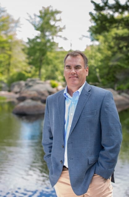 Man standing outdoord near water